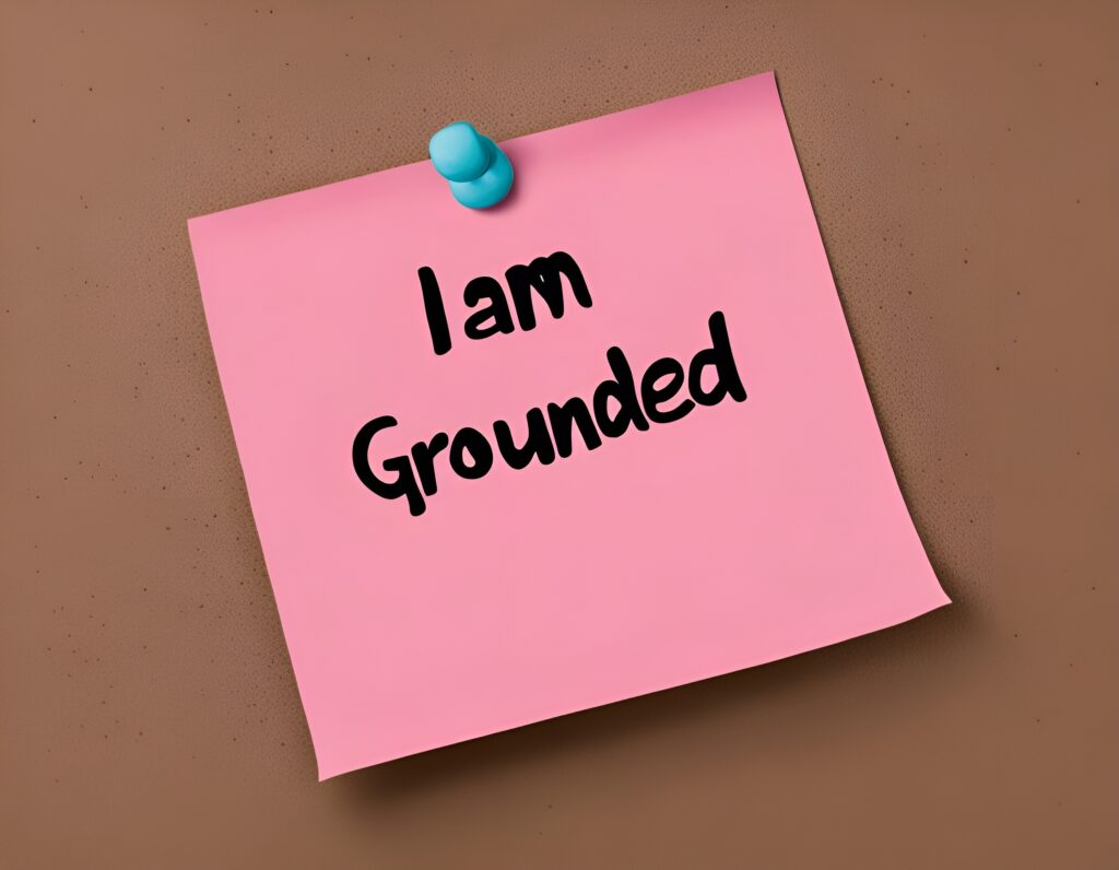 Pink sticky note with an affirmation written on it "I am grounded"