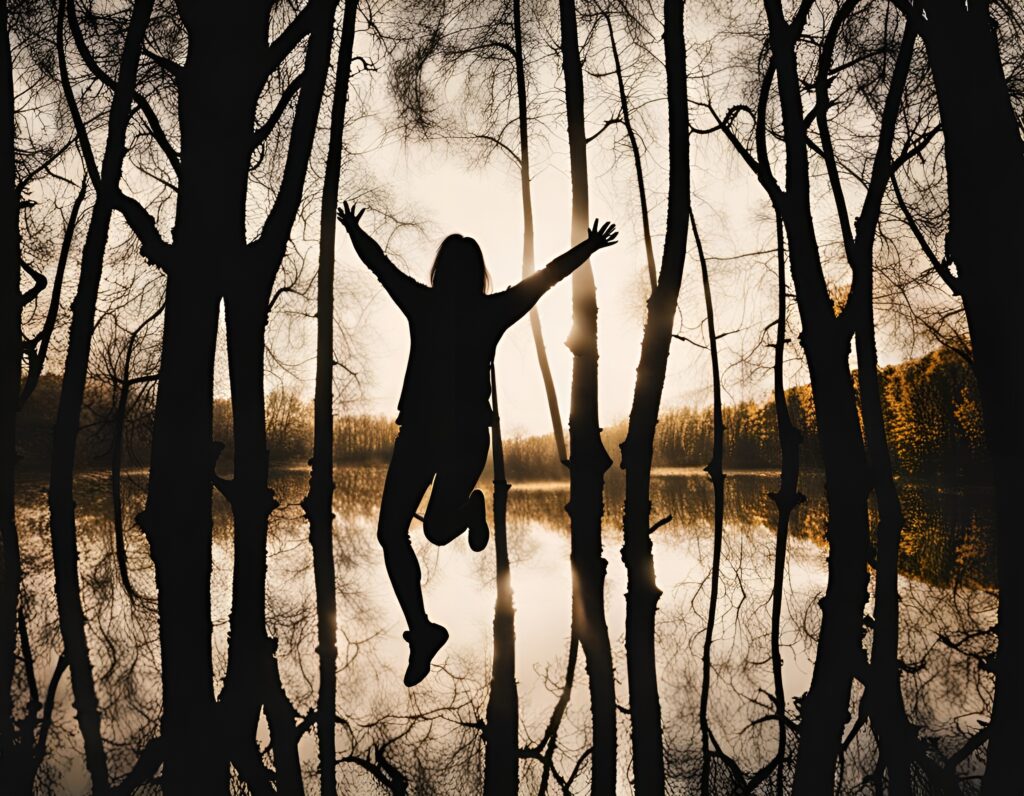 Happy person jumping amongst trees feeling empowered