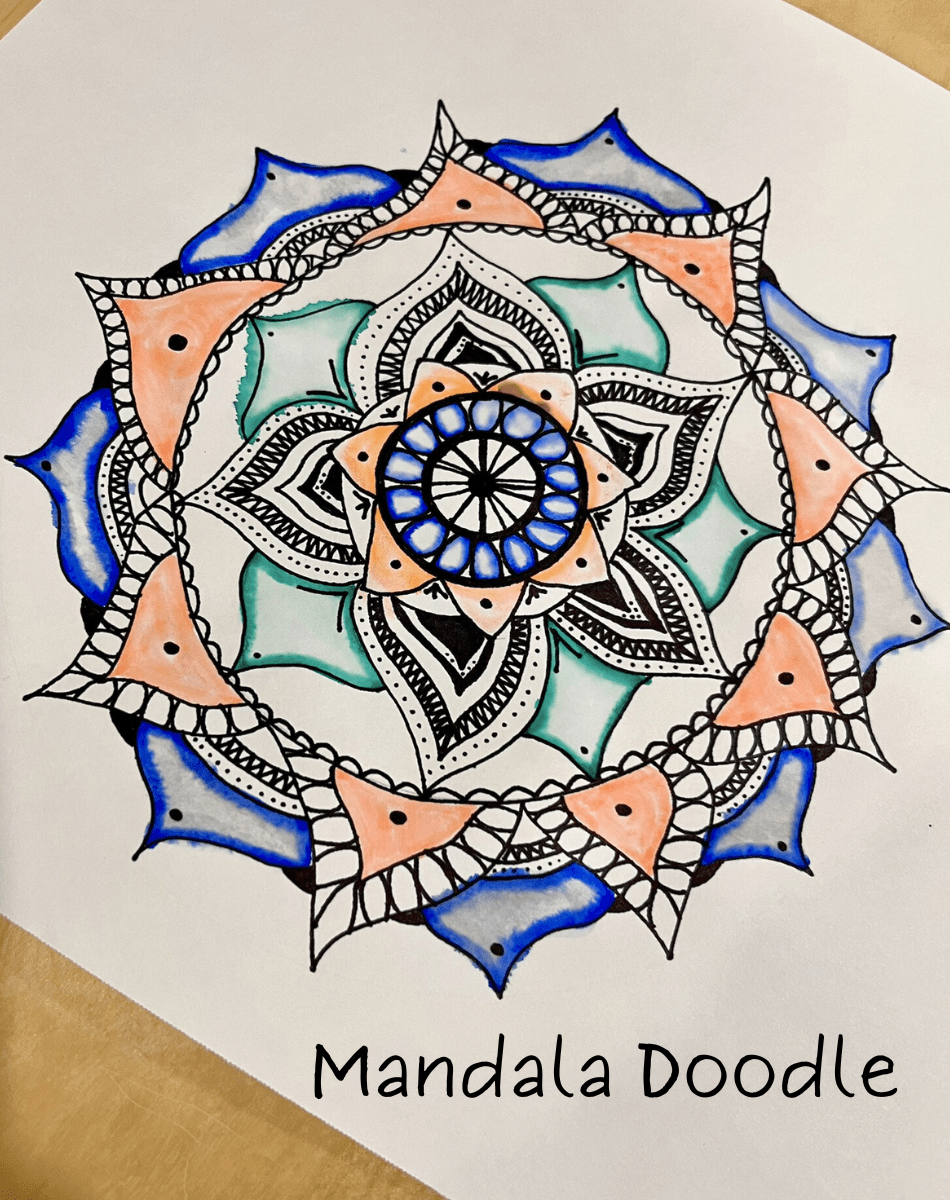 Example of a flower-inspired Mandala Doodle created with black marker and highlighted with blue, coral and green watercolour markers.